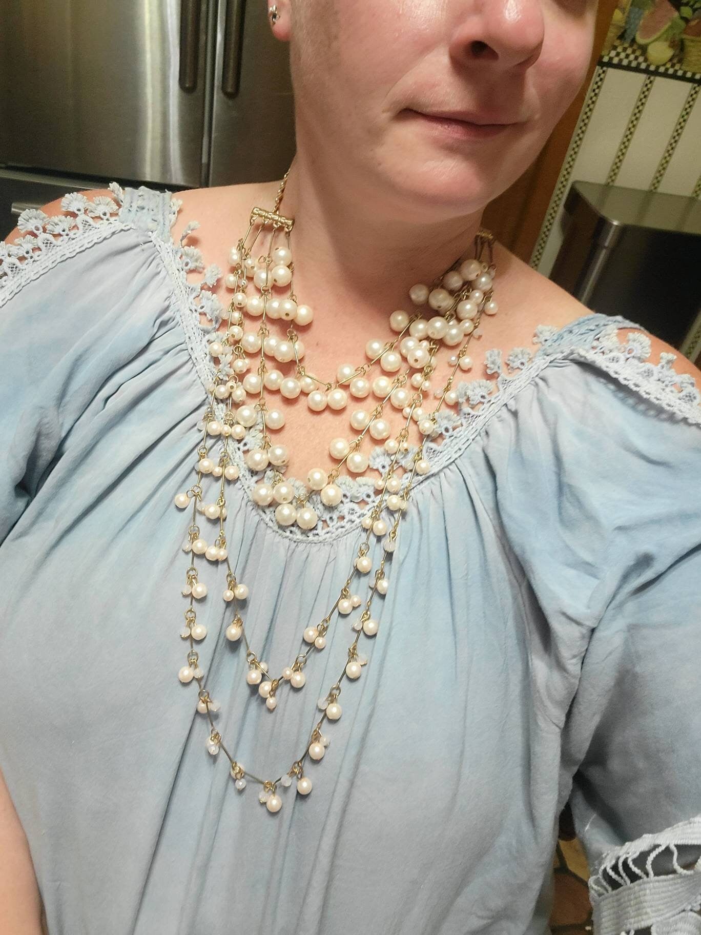 Multi-strand Long Pearl Necklace with earrings. Jeweled